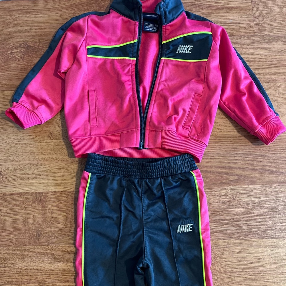 Nike matching track suit. 6-9mo. Lightly used. Great condition.